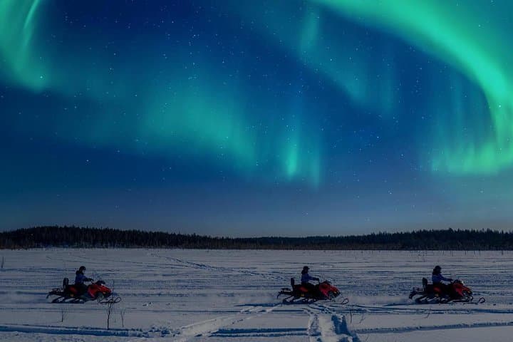Searching Northern Lights with Snowmobiles