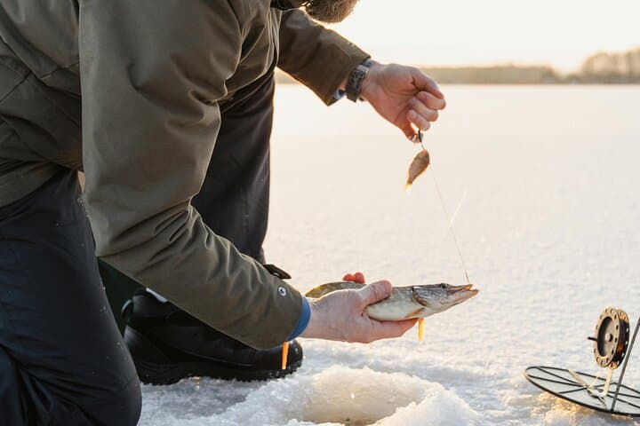 Ice Fishing Adventure in Lapland's Arctic Wilderness in Levi