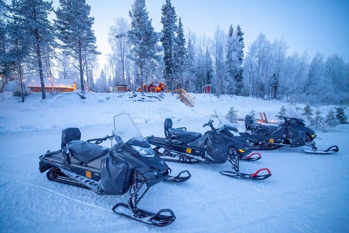 Snowmobiles parked outside our Riverside Sauna