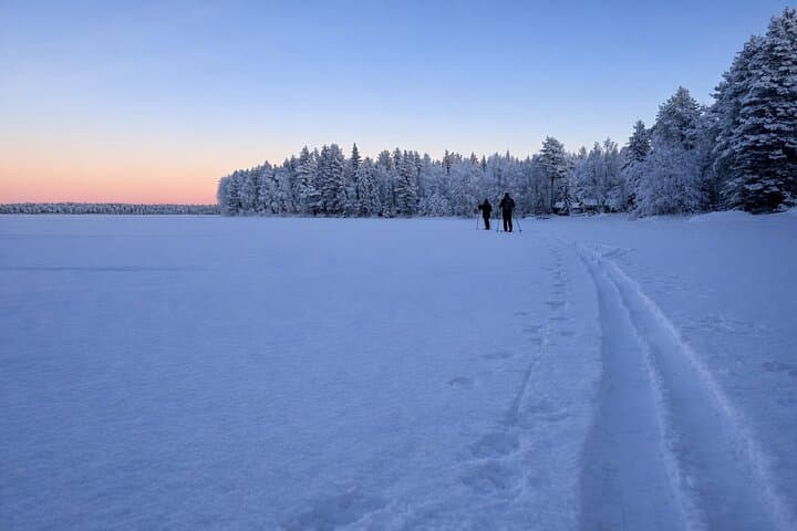 Skiing back across the lake at sunset