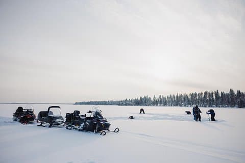 Ice Fishing and Snowmobile Safari Combo in Lapland