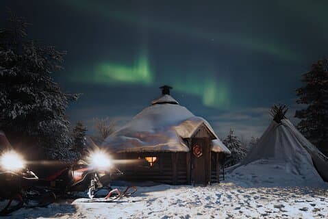 Northern lights safari by snowmobile