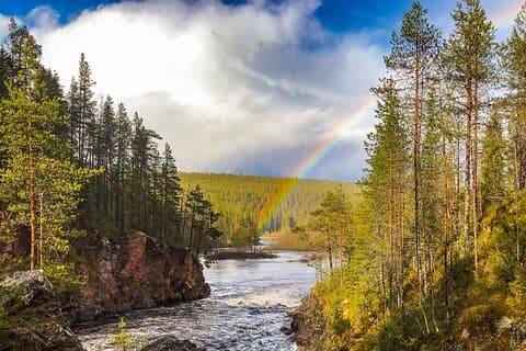 Rainbow over the river in Lapland