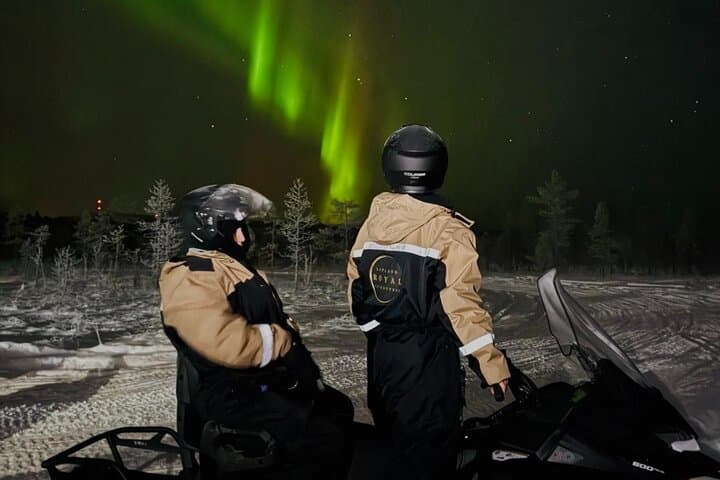 Arctic Aurora Chase by Snowmobile