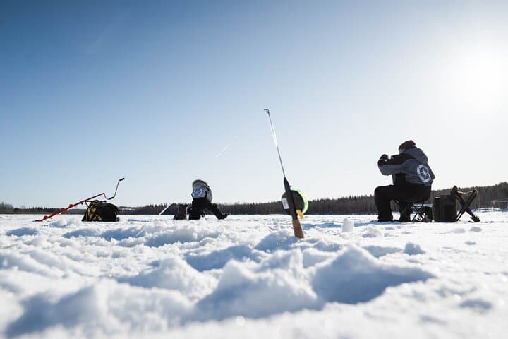 Ice fishing on a frozen lake