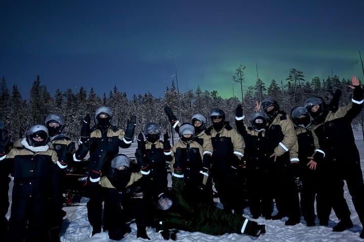 Arctic Aurora Chase by Snowmobile