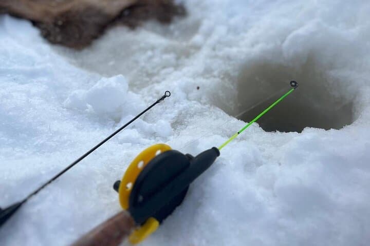 Lapland Winter Adventure Snowmobiling and Ice Fishing Experience
