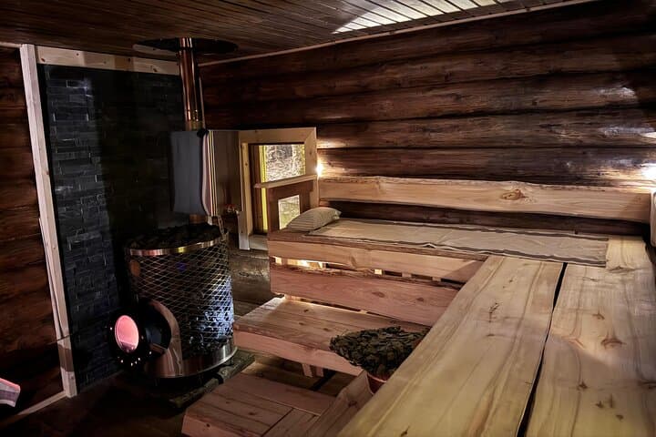 Private Snowmobile Safari with Riverside Sauna