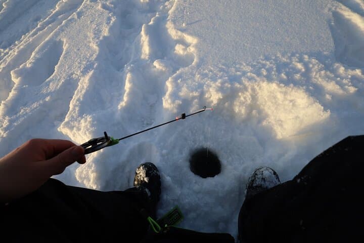Ice Fishing and Winter BBQ Experience in Finnish Wilderness