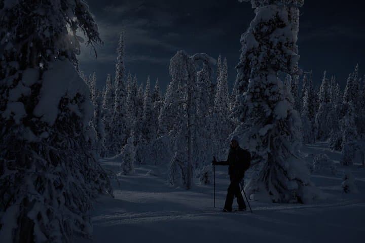 Ylläs: Northern Lights Skiing Across a Frozen Lake